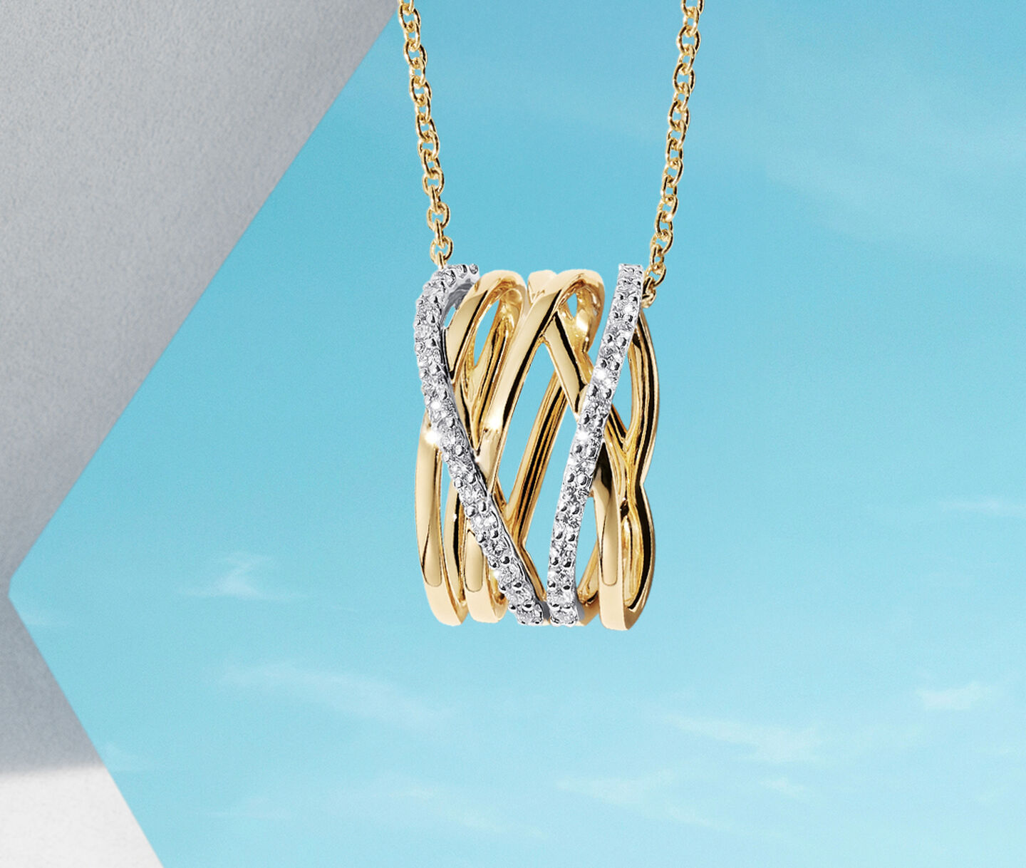 Birks Ros&eacute;e du Matin yellow gold and diamond necklace on a blue background.